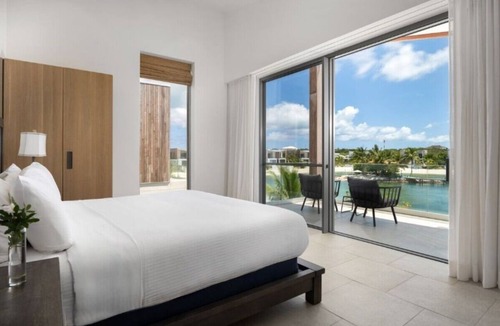 Long Bay Hills Hotel | Exclusive 5BR Island Retreat with Hot Tub, Rooftop Living & Lagoon Access