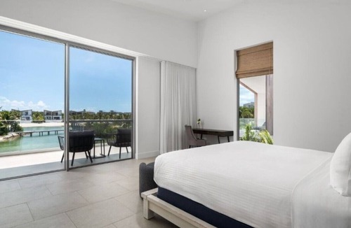 Long Bay Hills Hotel | Exclusive 5BR Island Retreat with Hot Tub, Rooftop Living & Lagoon Access