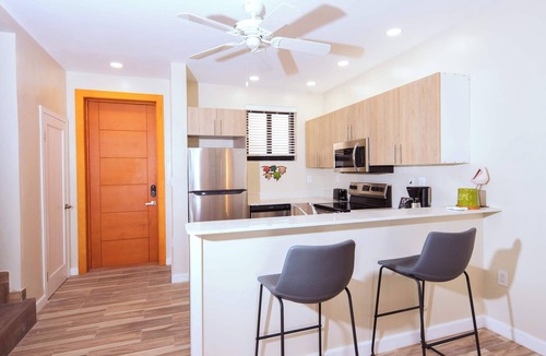 Leeward Settlement Apartment | Poolside Escape with Private Balconies, Near Beach