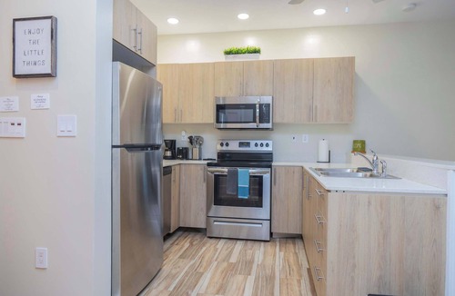 Leeward Settlement Apartment | Poolside Escape with Private Balconies, Near Beach