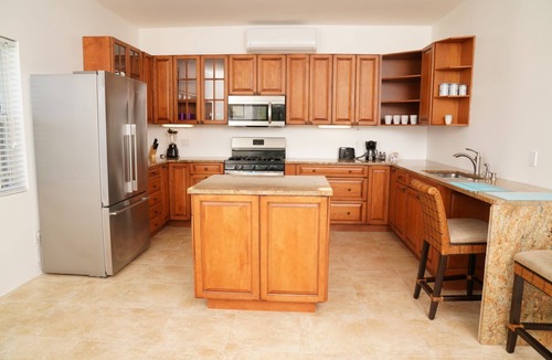 Long Bay Apartment | Tranquil 2 Bedroom Rental - 5 Mins to Beach, Private Deck, Pool & Hot Tub Access