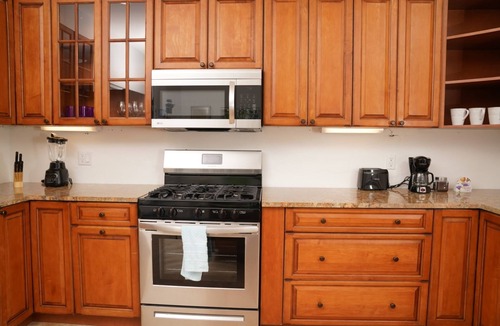 Long Bay Apartment | Tranquil 2 Bedroom Rental - 5 Mins to Beach, Private Deck, Pool & Hot Tub Access