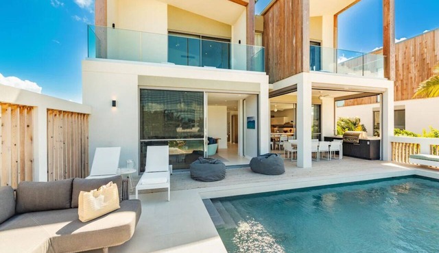 Exclusive 4BR Retreat with Private Pool, Lagoon Access & Open-Air Living in Long Bay Hills