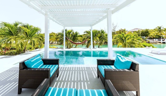 Live on I Land Time – Canal-Front Villa Loaded with fun Gears Near Grace Bay!
