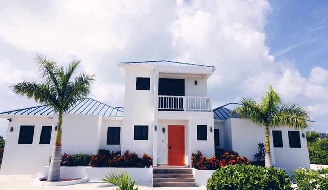 Poolside Escape with Private Balconies, Near Beach in Leeward Settlement