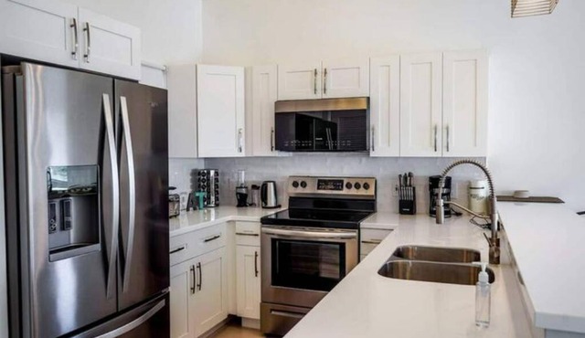 White Modern Flamingo Lake Villa in Turtle Cove
