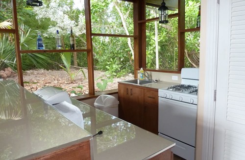Leeward Settlement Cottage | Charming Garden Cottage on the canal in Leeward