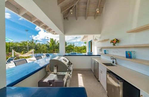 Caicos Islands Villa | Wakesurf Villa Waterfront Retreat with Dock Kayaks and Pool
